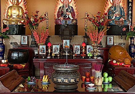 In many temples, including this one in Canada, the shrine typically has, as three principle deities: Buddha (here on left); Lao-Tzu (founder of Taoism) and Confucius. Combining these three traditions raises no eyebrows in Asia, since the philosophies and beliefs are similar (in many ways) and complimentary. Pictured Fung Loy Taoist Tai Chi International Centre near Orangeville, Ontario. 