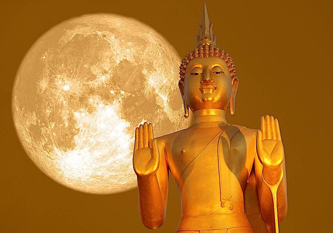 Buddha statue against a full moon. Lunar calendar is very important in Buddhism, with most major events celebrated according to the lunar calendar.