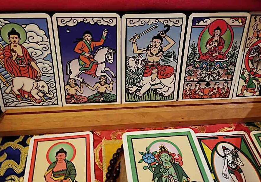 Buddha Tarot by Robert Place features the life and journey to Enlightenment of Siddartha Buddha as the major Aracana, in place of the "fool's journey" to spiritual enlightenment.