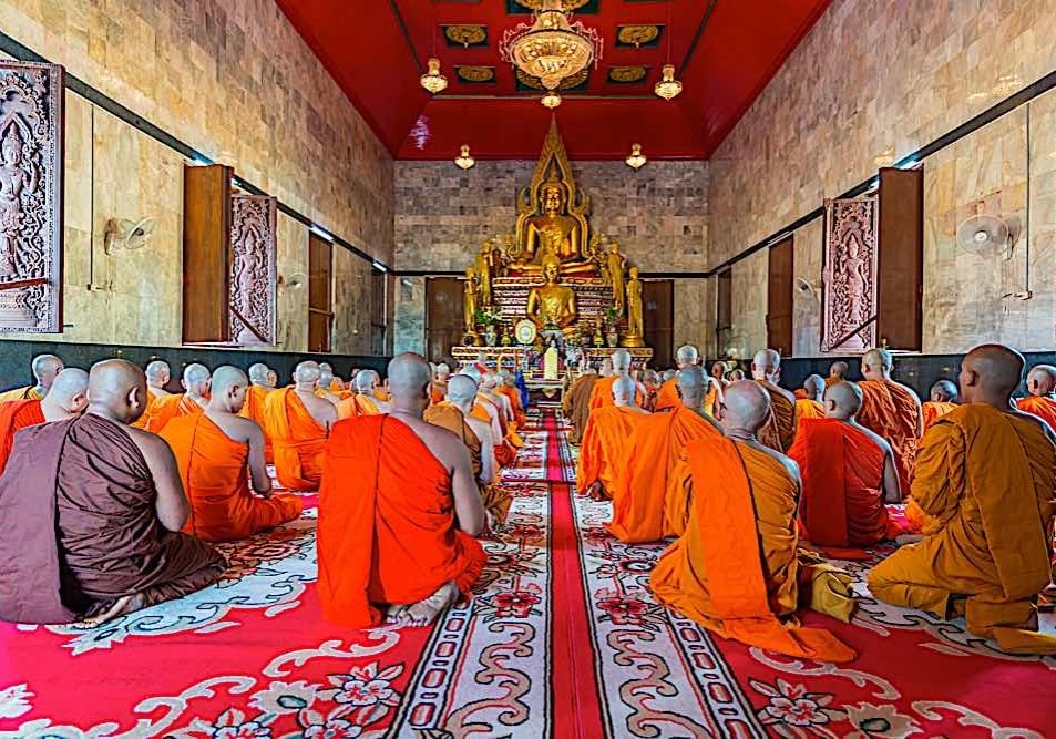 Most traditions of Buddhism hold chanting of Sutras as a primary practice of great merit. Here monks are chanting in Kanchanburi Thailand in front of a golden Buddha.