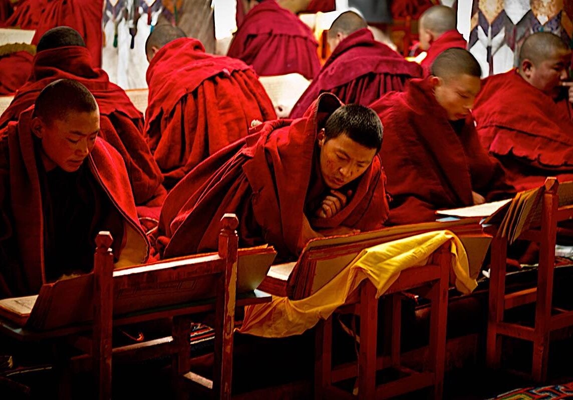 Monks practicing Sadhana at a retreat at Drepung Monastery Lhasa, Tibet. Sadhanas are ritualized text that help us learn, but they are also sacred Dharma texts meant to be recited word for word.