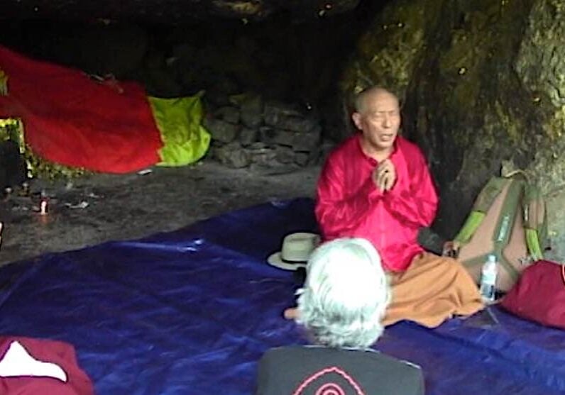 Venerable Zasep Rinpoche teaching on  Heart Sutra in a sacred cave near Vulture Peak mountain, India, where the original Heart Sutra was taught.