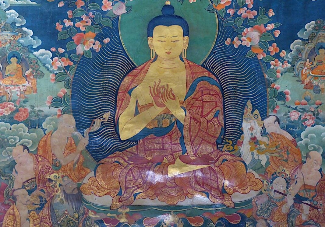 Wall mural painting of The Buddha in Dharmchakra Teaching Mudra, representing the Turning of The Wheel of Dharma mudra or pose, Jokhang Temple, Lhasa, Tibet. In Buddhism, the Dharma Chakra symbolizes "teaching." The Jokhang is a Buddhist temple in Barkhor Square in Lhasa, the capital city of Tibet and became a UNESCO World Heritage Site as an extension of the Potala Palace in 2000.